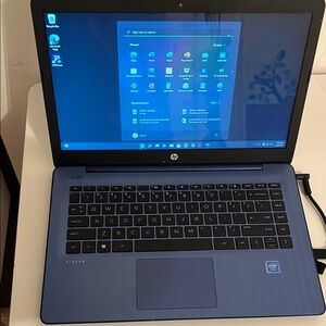 HP Blue and Black Slim Laptop with Windows Interface